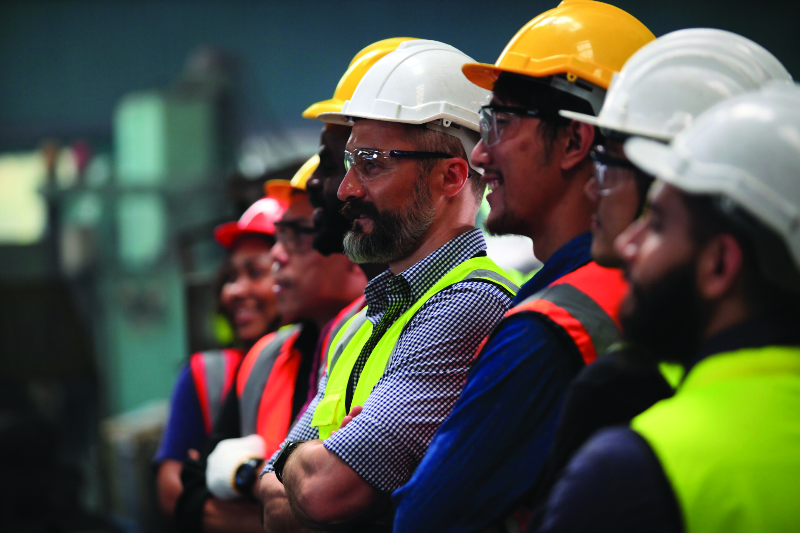 Candid photo of a group of engineers smiling.
